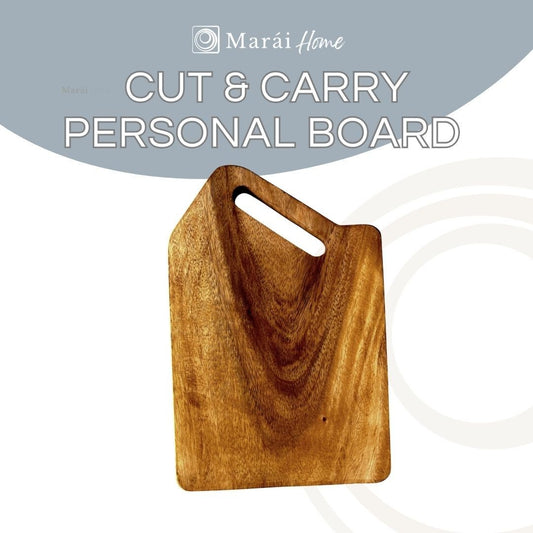 Marai Home acacia wood cutting and serving board with handle. Natural wood grain.