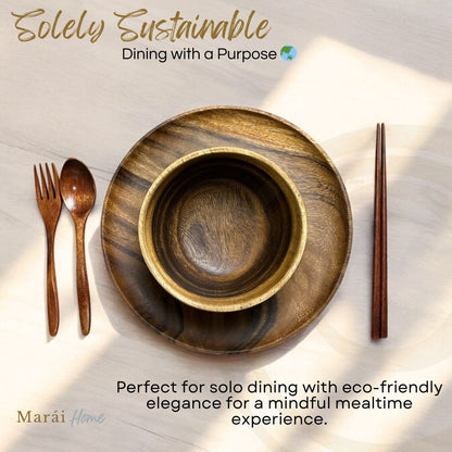 Marai Home Solely Sustainable acacia wood dining set including a round plate, soup bowl, fork, spoon, and chopsticks.
