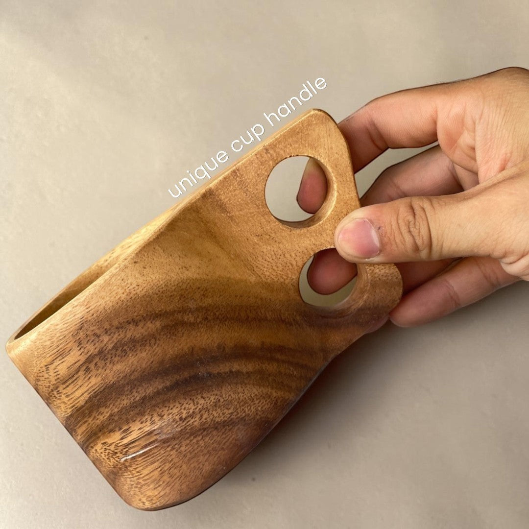 Marai Home handcrafted acacia wood mug with a unique double-hole handle, natural wood grain, perfect for coffee or tea.