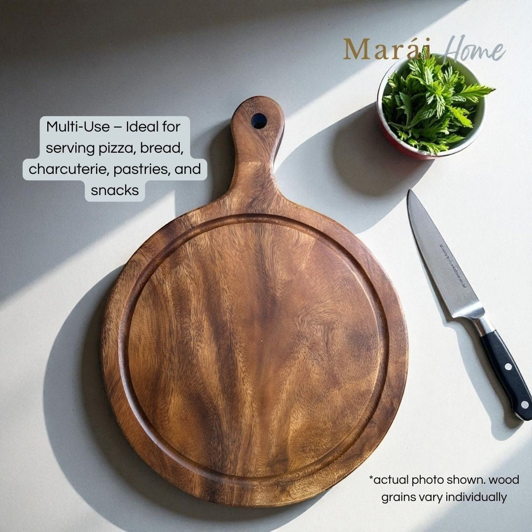 Marai Home round acacia wood pizza board with groove and handle, ideal for serving charcuterie and snacks.