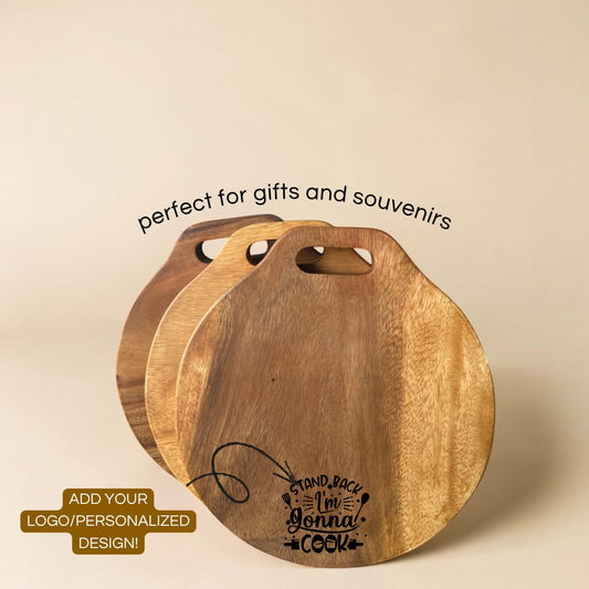 Marai Home Classic Round Acacia Wood Serving Board with handle and "I'm gonna cook" engraving. Perfect for cutting, serving, or decor.