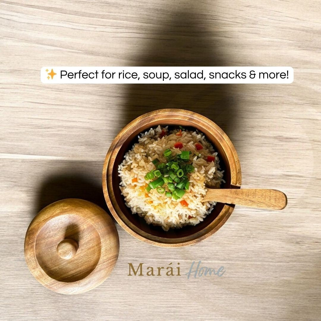 Marai Home acacia wood serving bowl with cover and spoon, filled with rice and garnished with green onions.