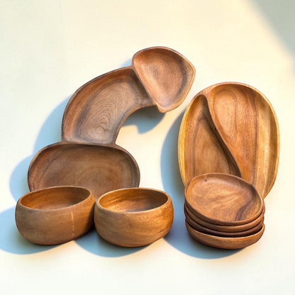 Marai Home Party Starter Bundle featuring acacia wood serving boards, a YinYang platter, bowls, and small round plates.