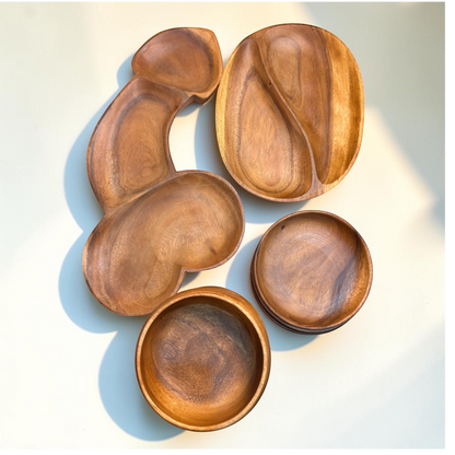 Marai Home Party Starter Bundle featuring acacia wood serving boards, a YinYang platter, round plates, and bowls.