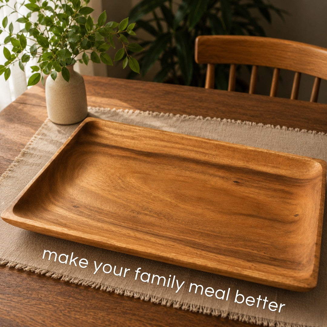 Marai Home rectangular acacia wood serving tray with natural grain on a dining table with a linen placemat