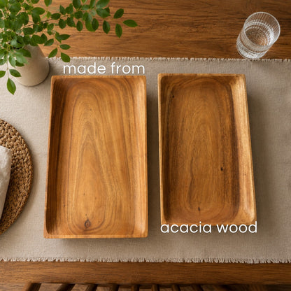 Marai Home rectangular serving trays made from natural acacia wood with visible grain on a dining table