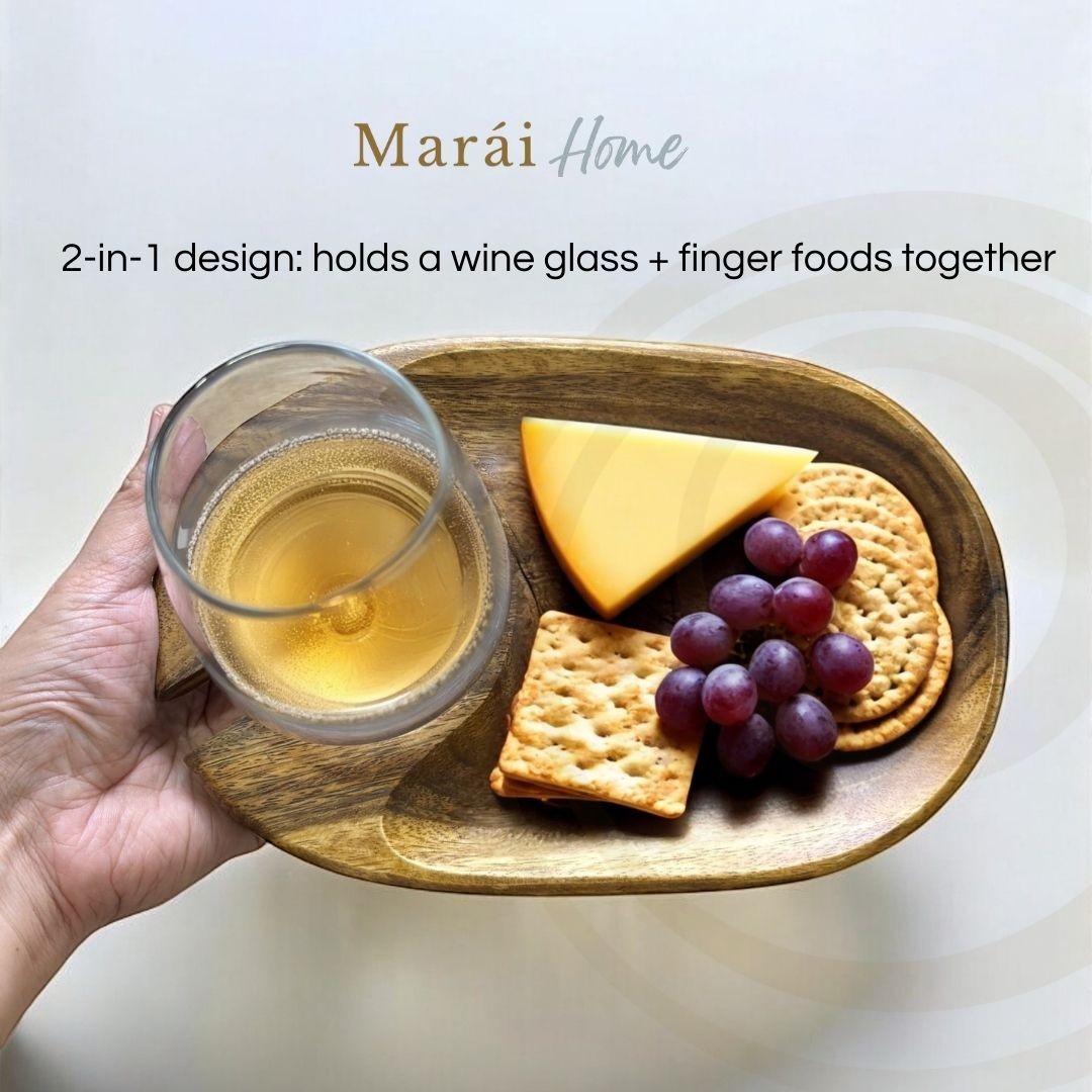 Marai Home 2-in-1 acacia wood wine and cheese carrier with glass holder, crackers, cheese, and grapes.