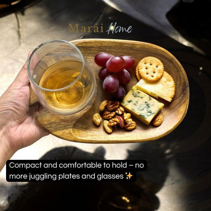 Marai Home acacia wood 2-in-1 wine and cheese carrier with glass holder, holding grapes, cheese, nuts, and crackers.
