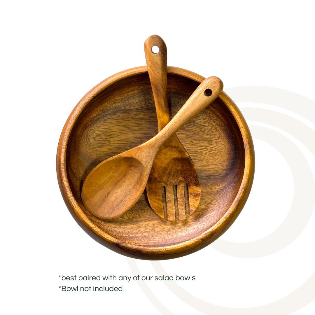 Marai Home wooden salad servers featuring a fork and spoon with ergonomic handles resting inside a wooden bowl.